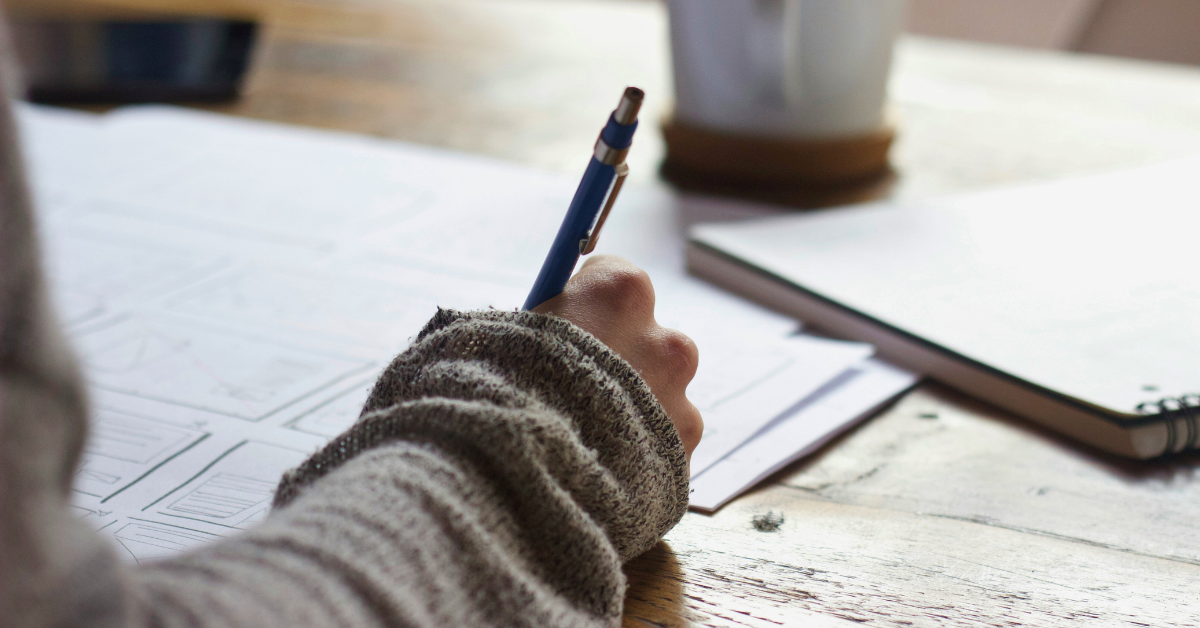 Woman writing in a journal