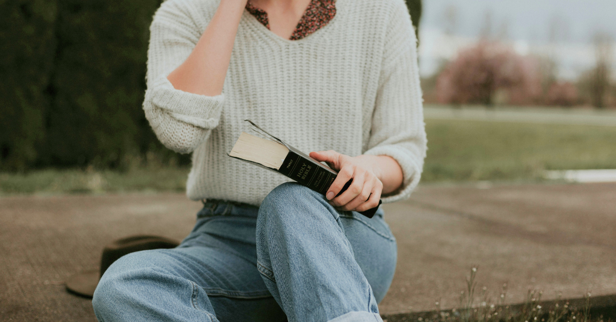 woman holding a Bible