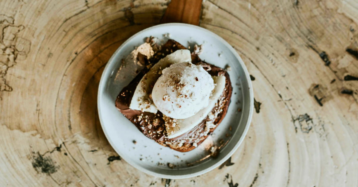 Chocolate and Vanilla Dessert on a Wood Table